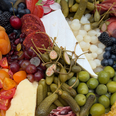Close up of artisan cheese, meats & pickles. Food for a Cambridge May Ball 